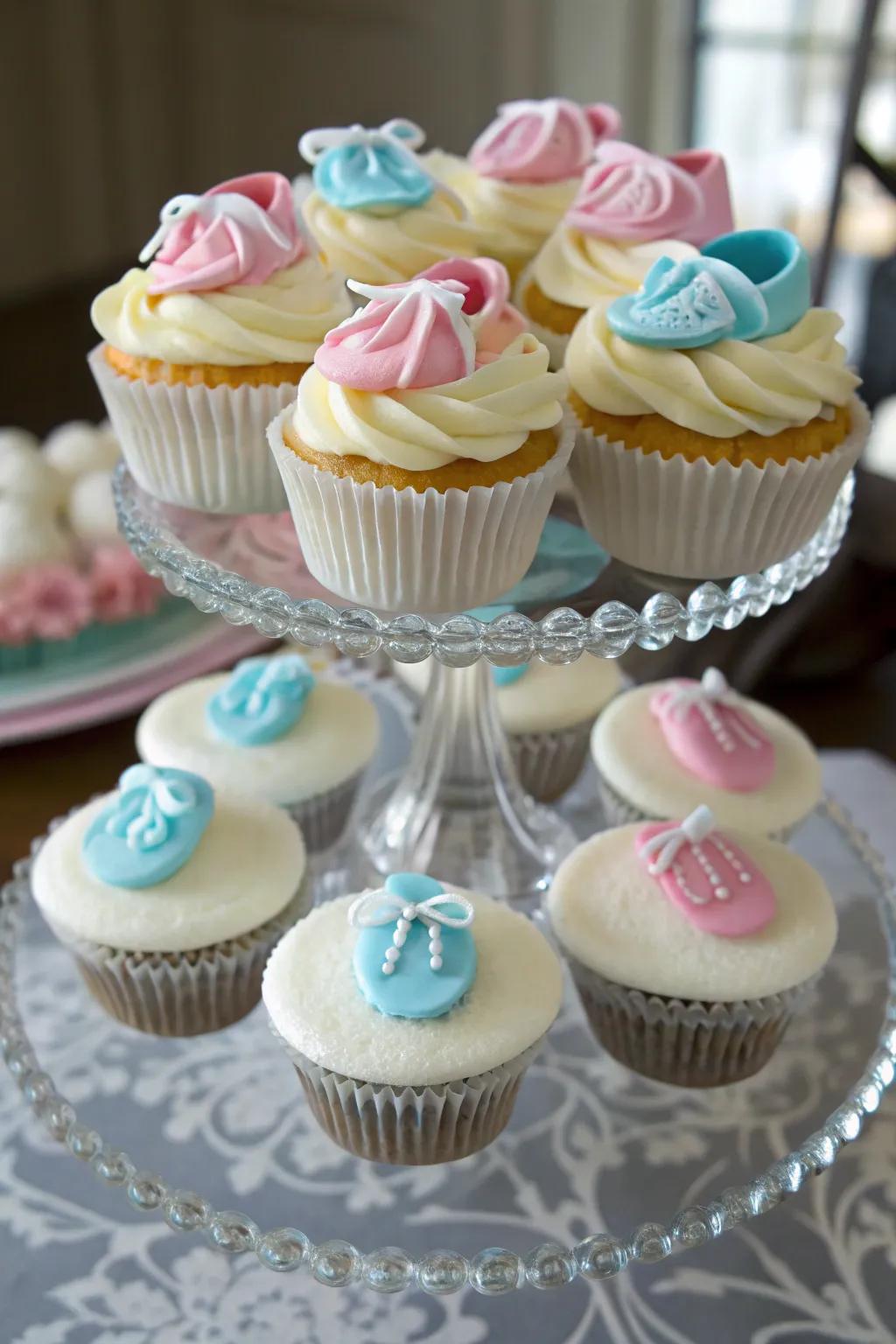 Charming infant bootie-topped cupcakes add a whimsical detail.