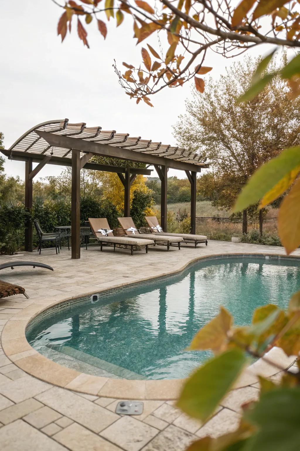 An arbour provides an impeccable shaded seating area beside the pool.