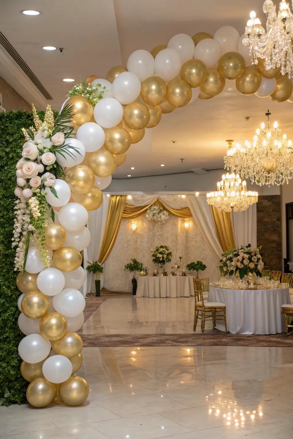 An elaborate gold and ivory balloon gateway suitable for sophisticated gatherings.