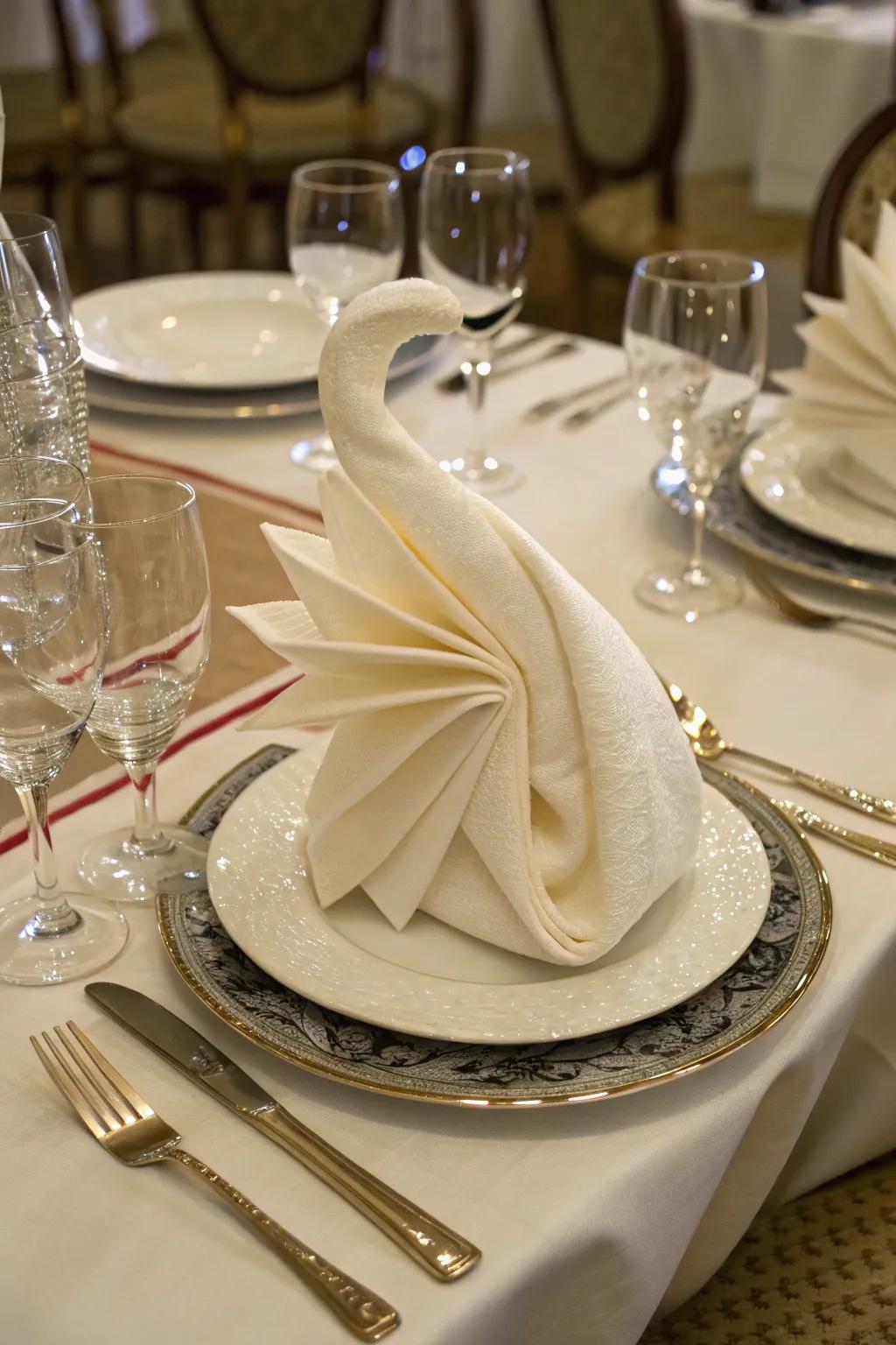 A waterfowl textile fold adds an element of charm to any dinner.