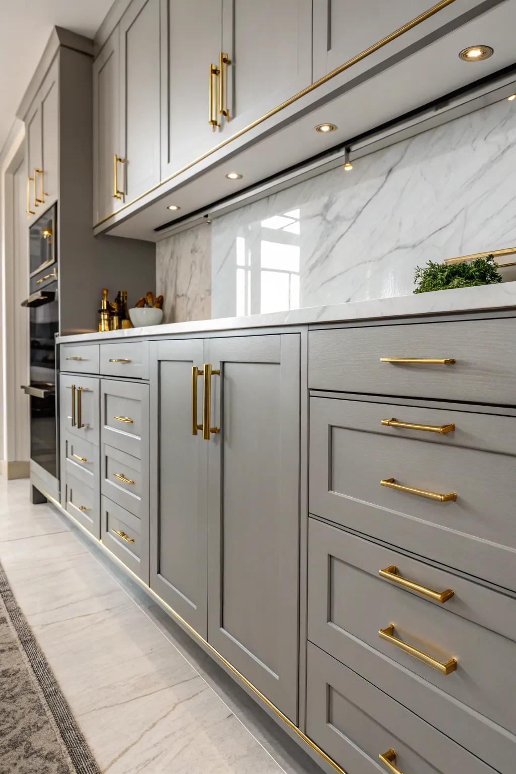 Gilded metal hardware imparts an aura of sophistication to gray cabinets.