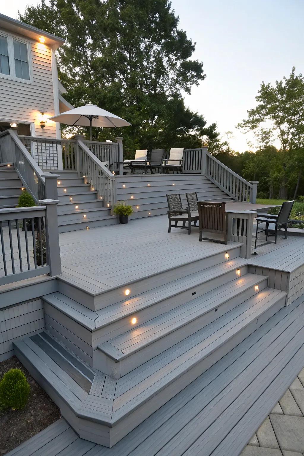 A multi-tiered grey patio, creating clearly defined areas for different uses.