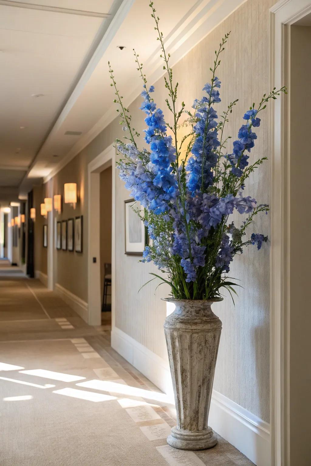 Soaring delphinium stems introducing elegance to an entryway.