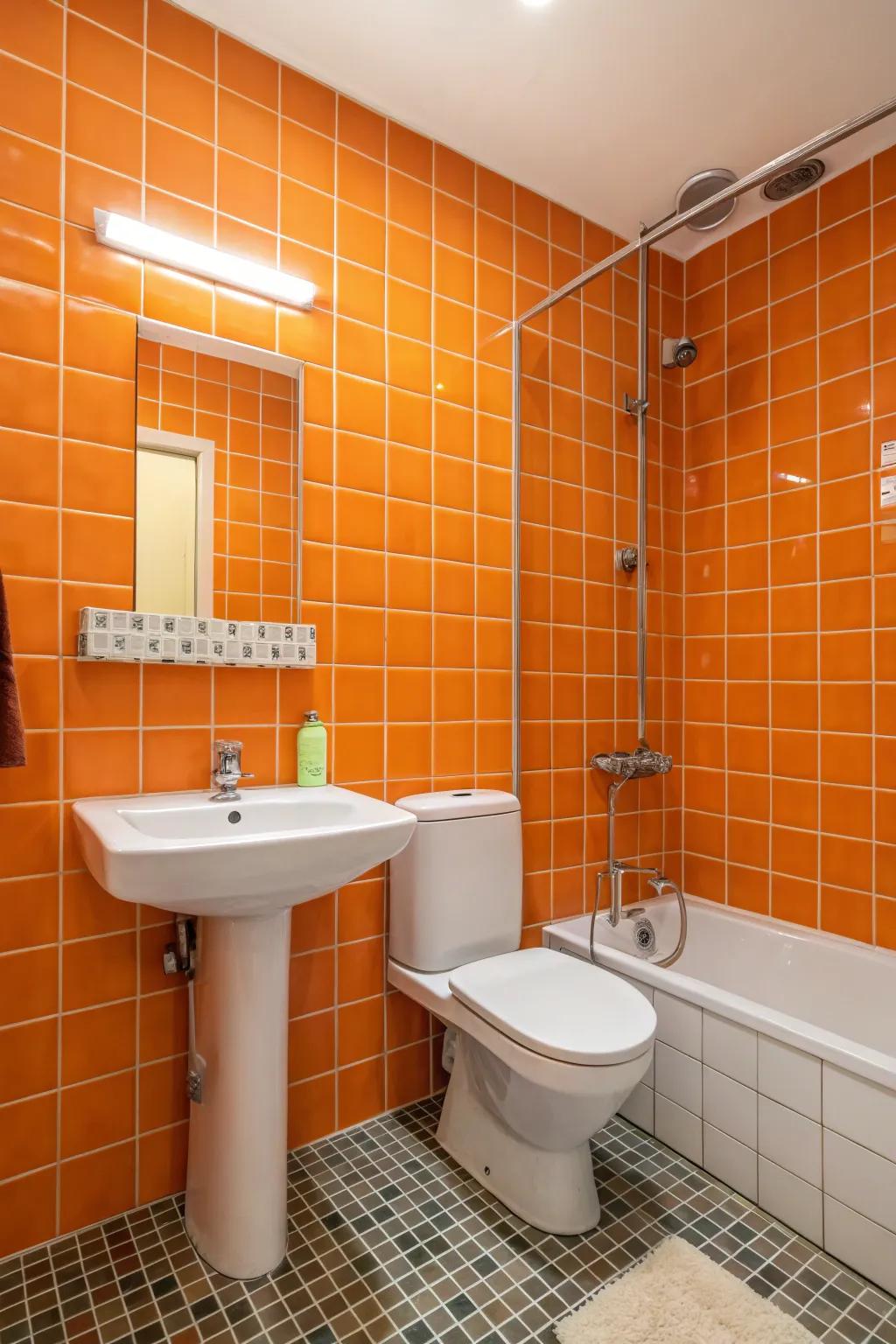 An orange tiled wall imparts texture and personality to the bathroom.