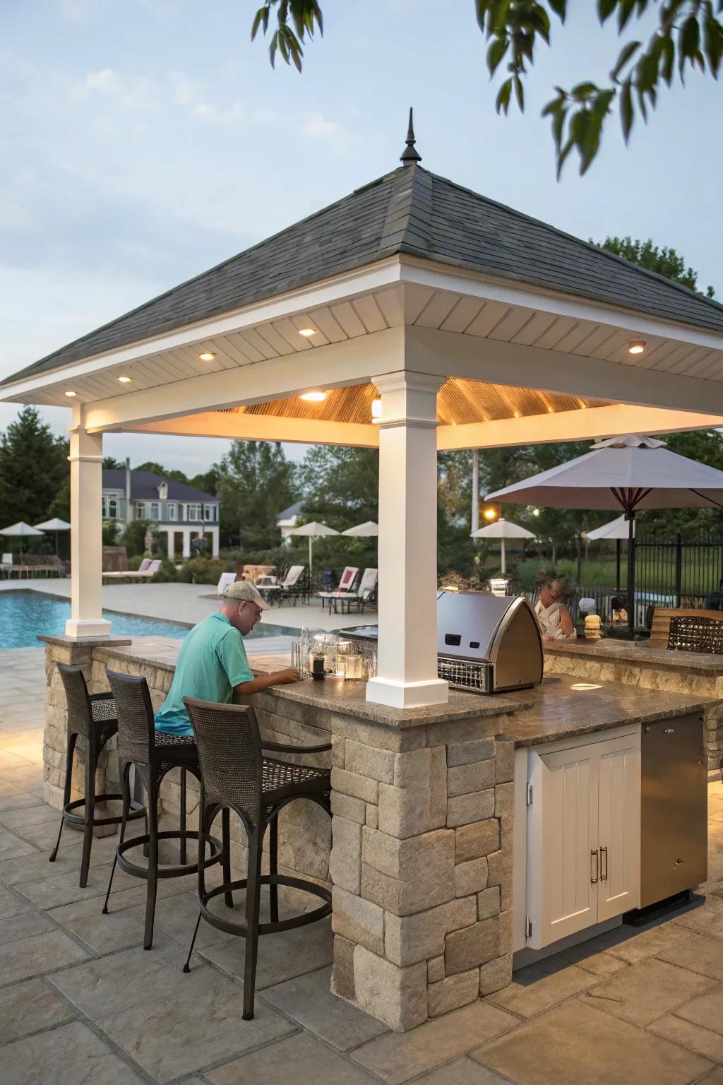 A shelter with an outdoor culinary space is excellent for poolside cooking and gatherings.