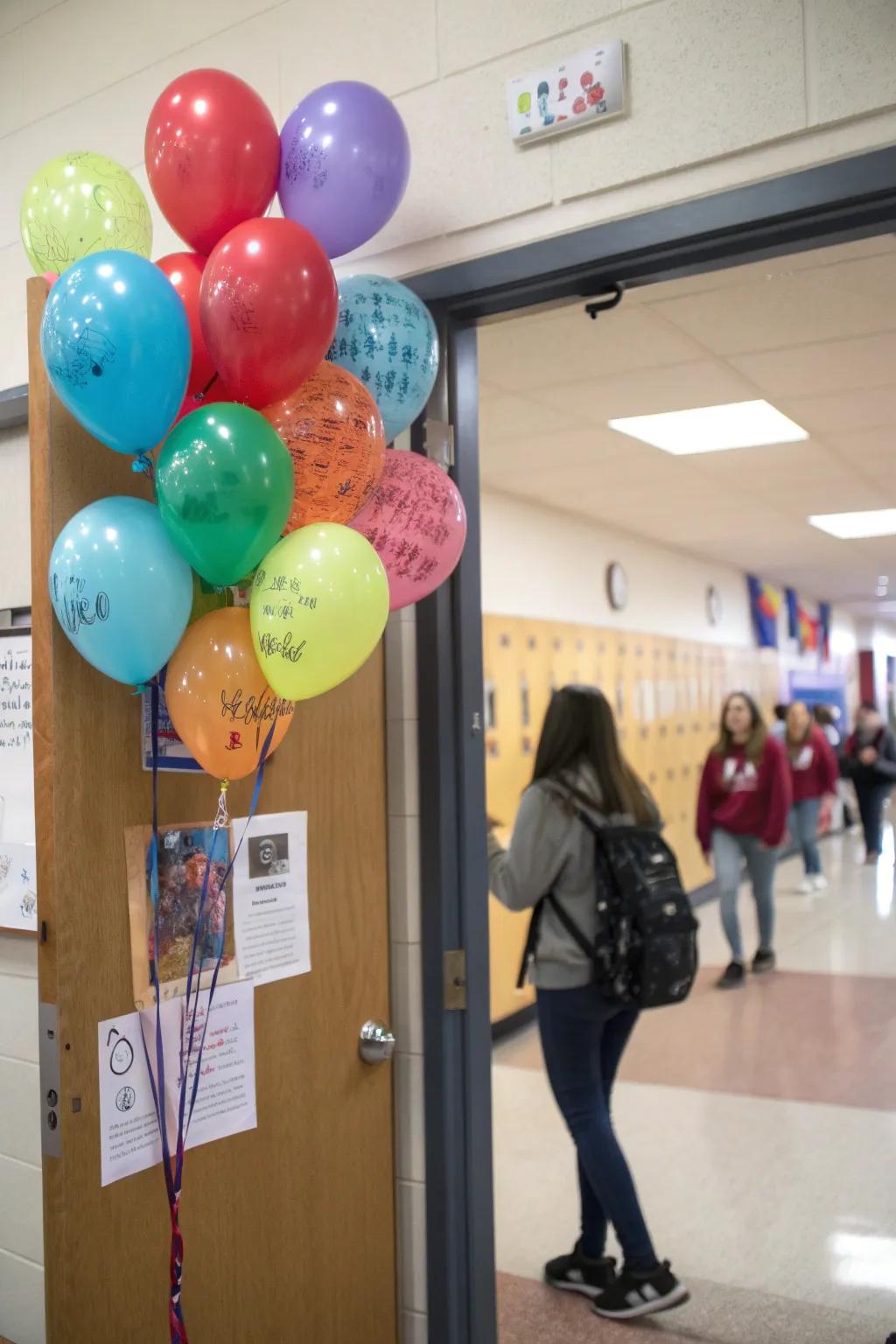 An interactive classroom door featuring balloons where students can write kind messages.