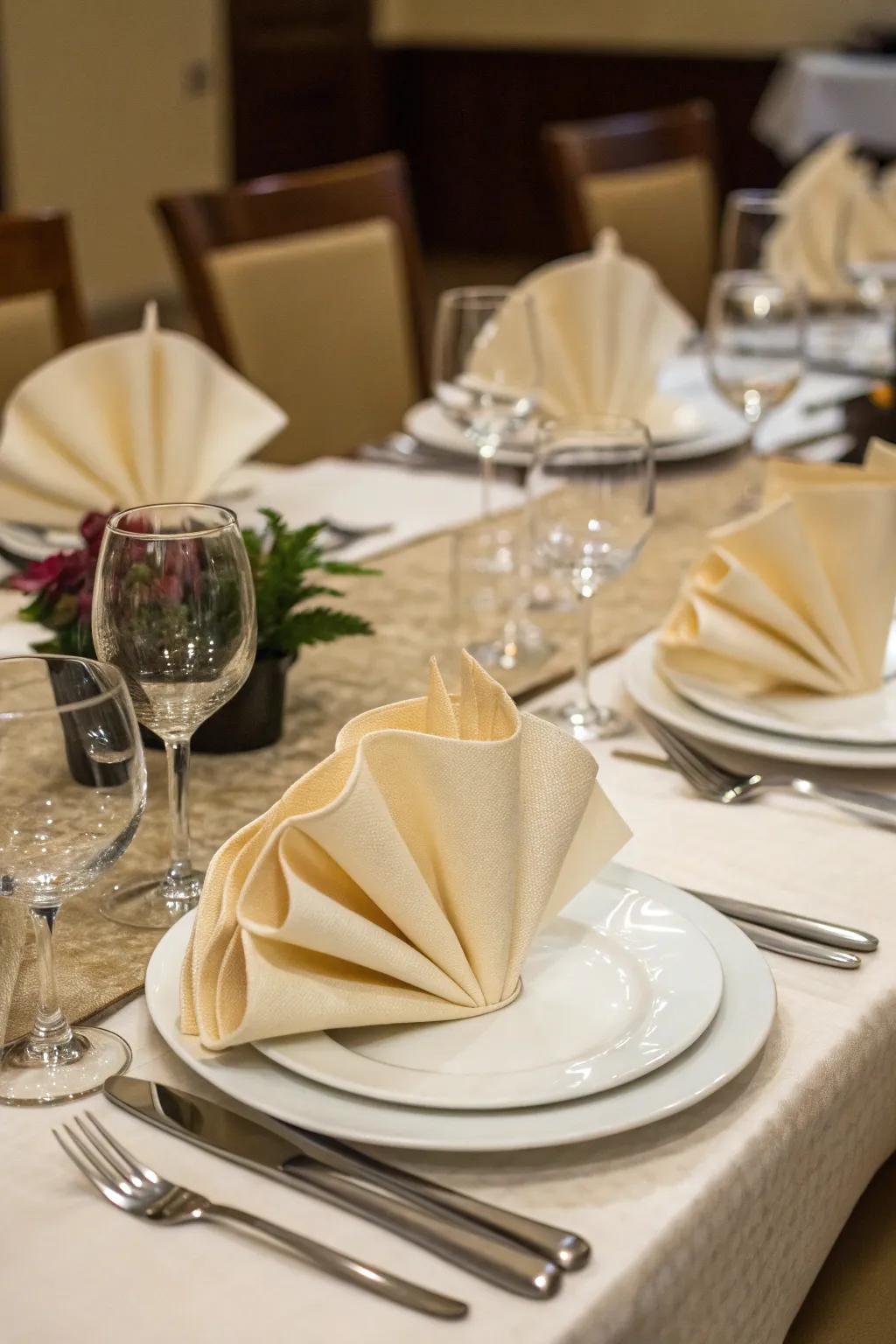 Creatively folded napkins add a personal touch to the table.