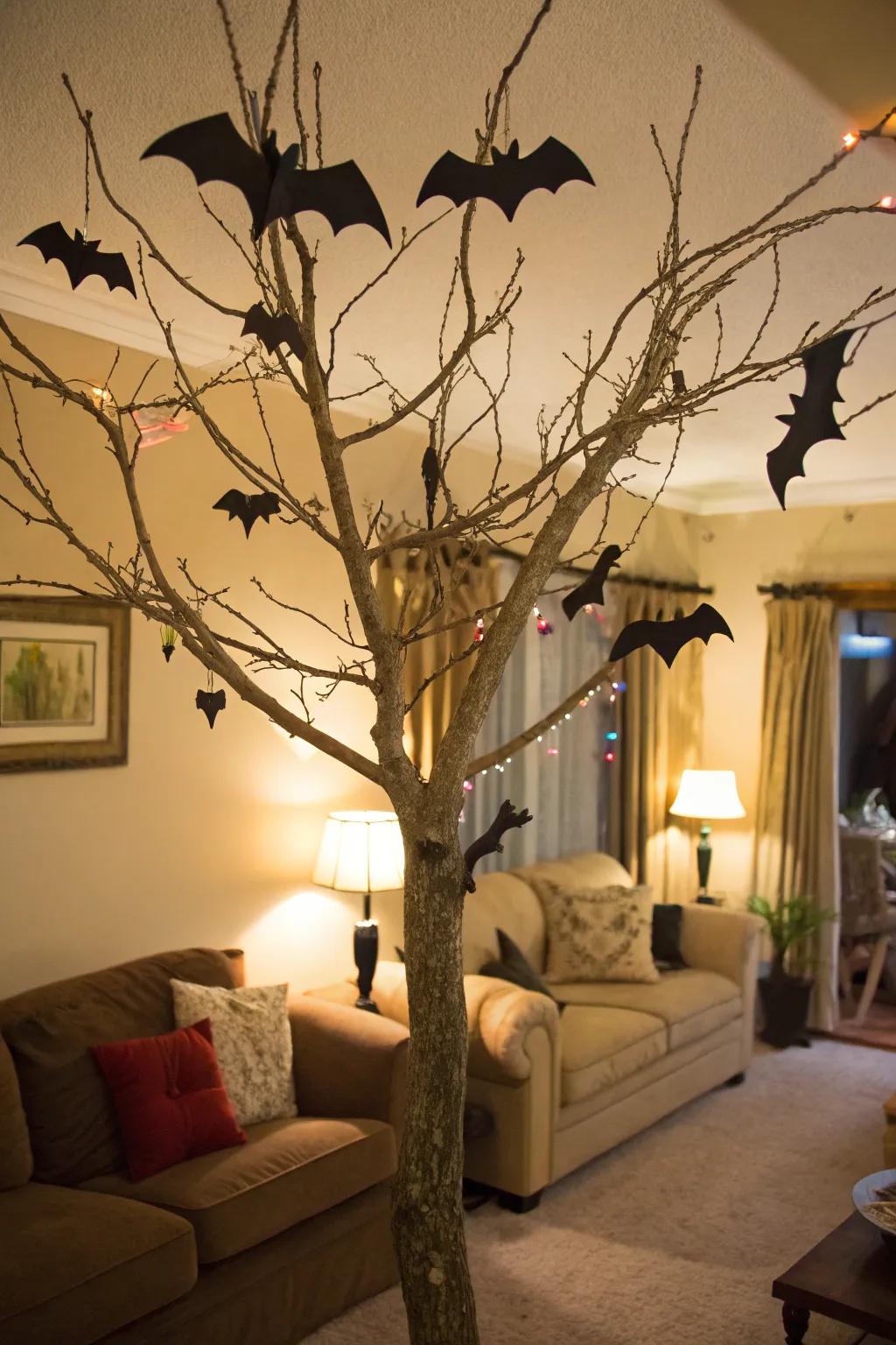 A spooky Halloween tree embellished with fluttering nocturnal flyers.