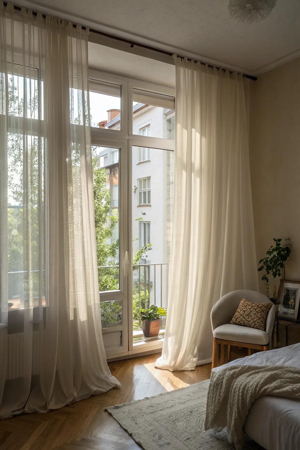 Long drapes enhance the height and light in a small apartment.