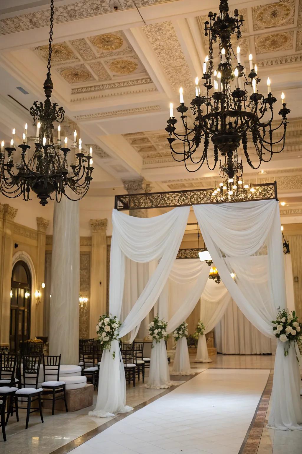 Black chandeliers add an elegant touch to a stylish wedding venue.