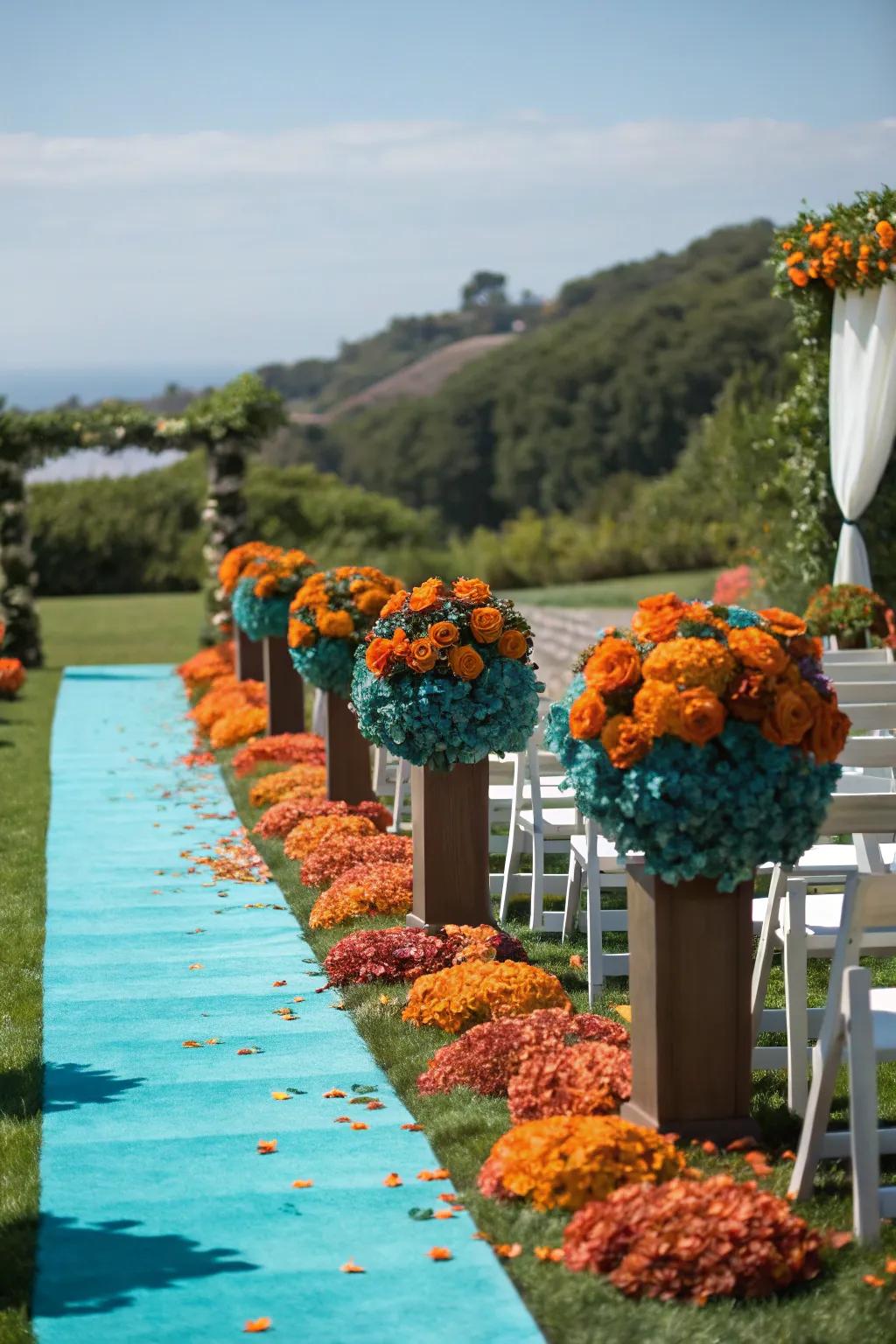 A wedding path adorned with ocean and sunset-hued blossoms.
