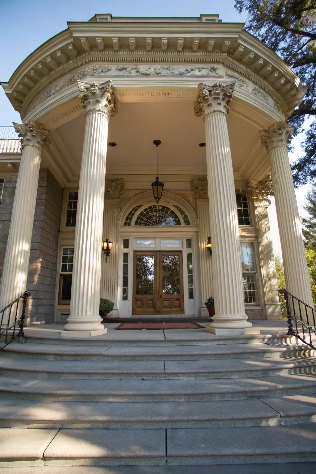 An elegant portico adds grandeur to the entryway.