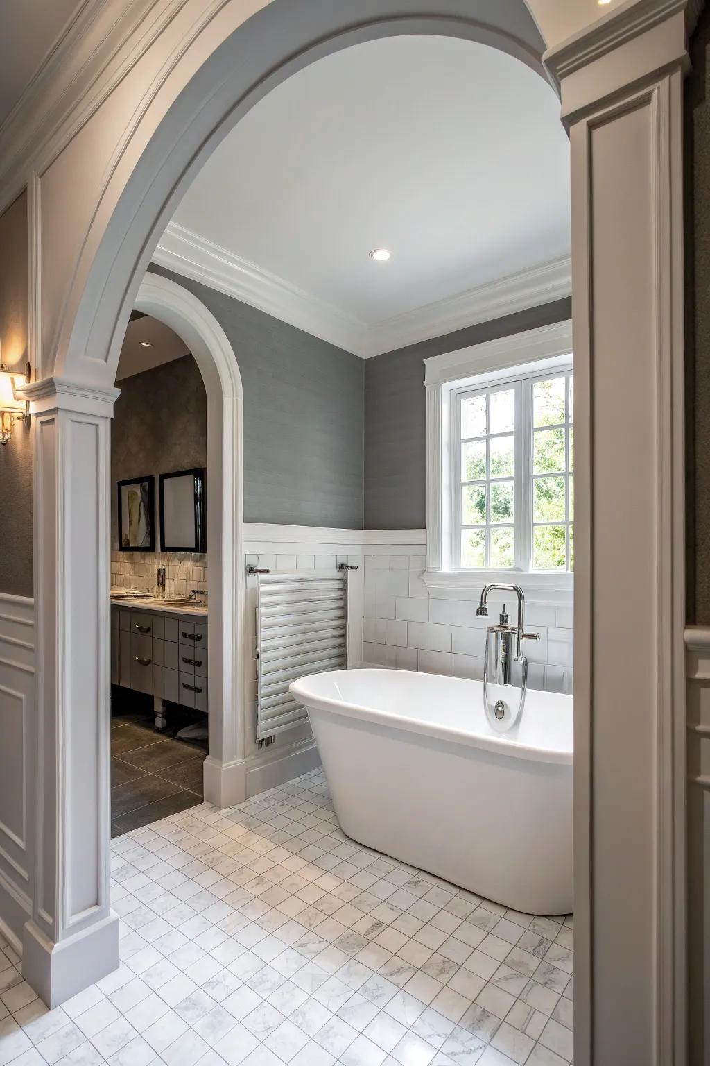 Grey walls with white features establish a classic and unified bathroom design.