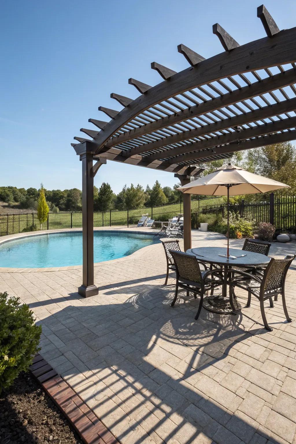 A pergola offers a shaded retreat on the pool deck.