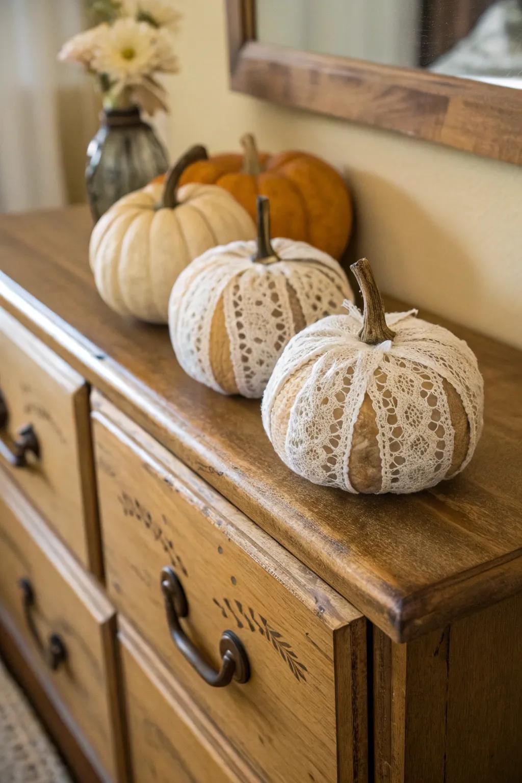 Textile-wrapped pumpkins radiate antique charm and grace.