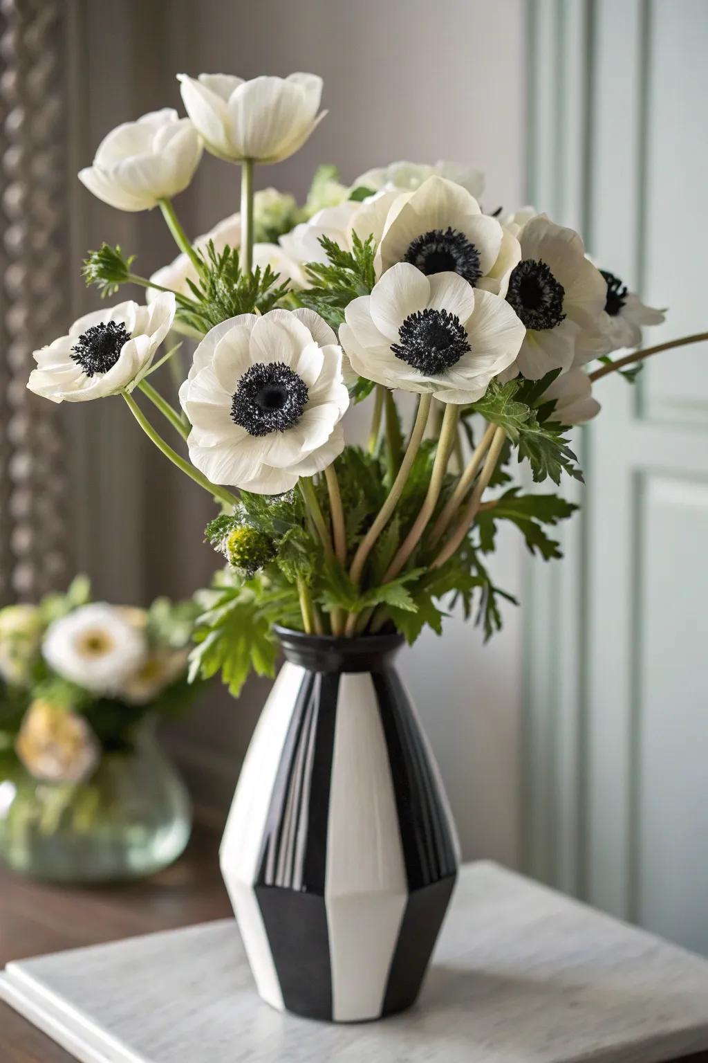A stylish anemone bouquet with striking dark and pale accents.