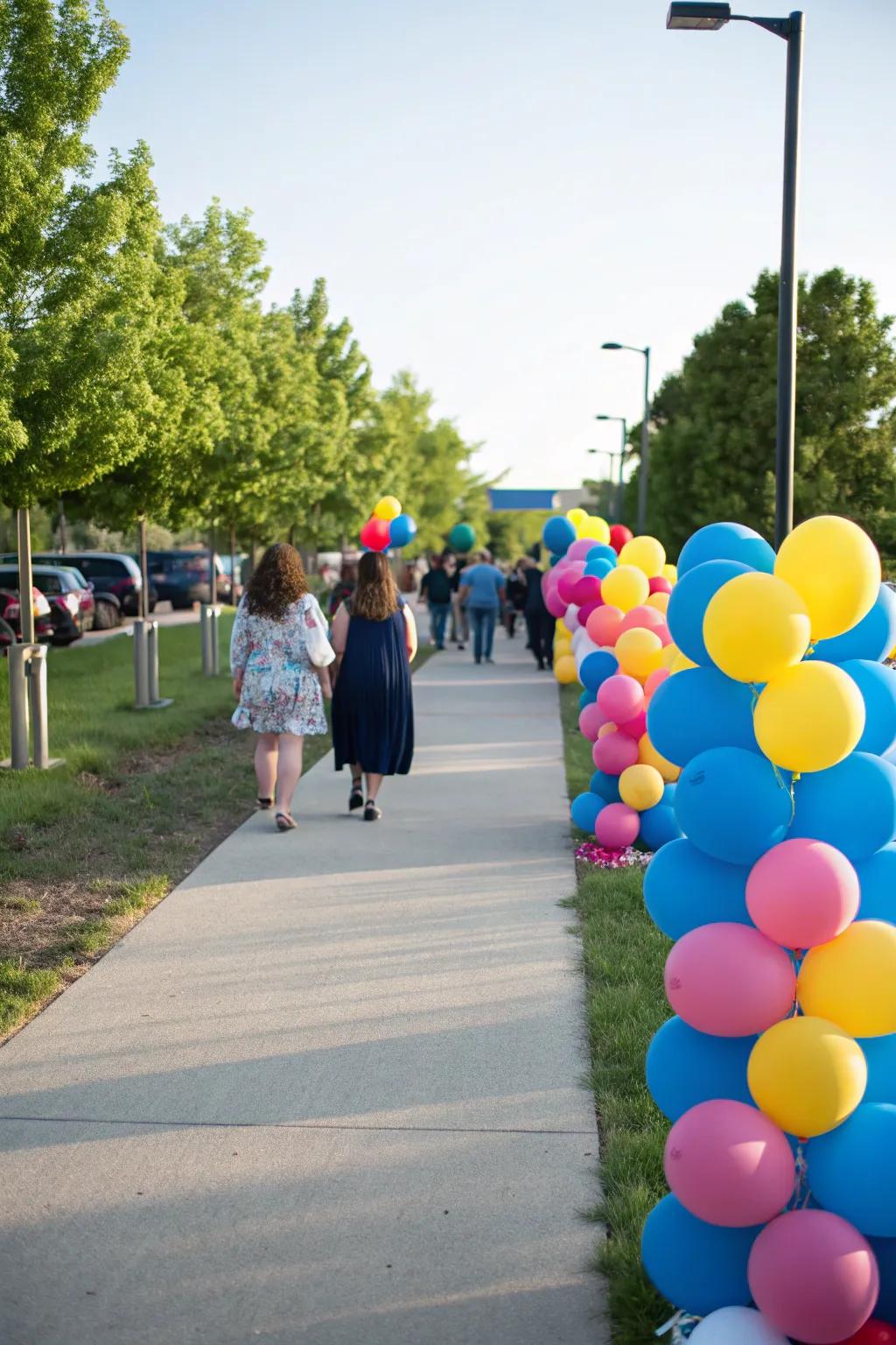 A festive outdoor balloon pathway leads guests to the celebratory event.