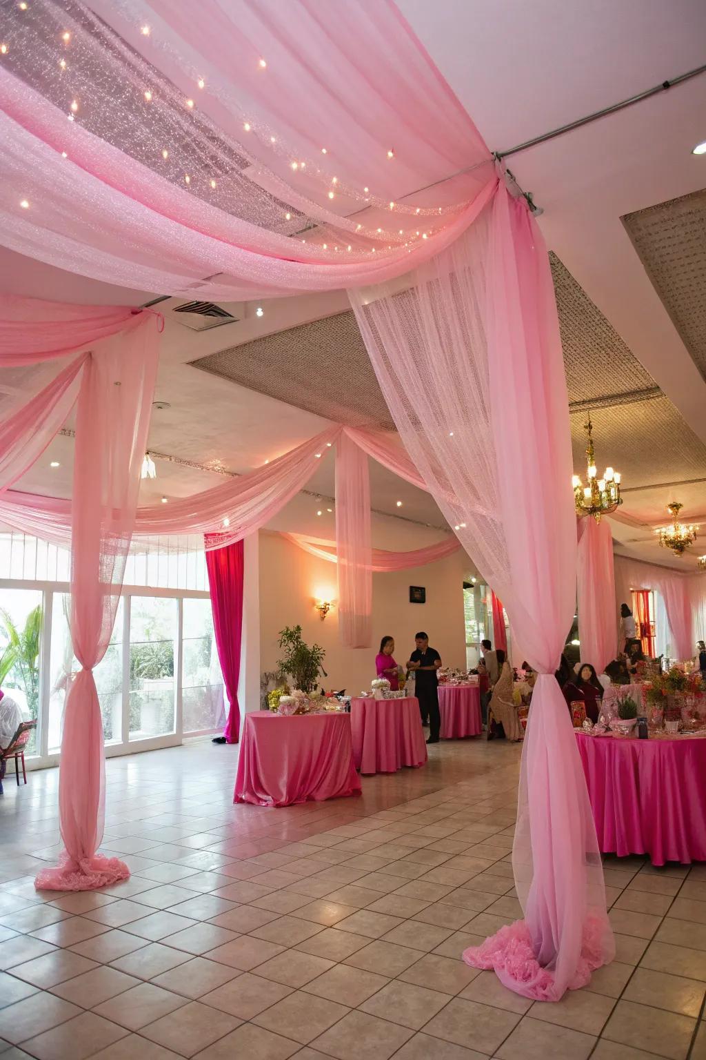Rose-colored tulle draping creates a whimsical and dreamy party vibe.