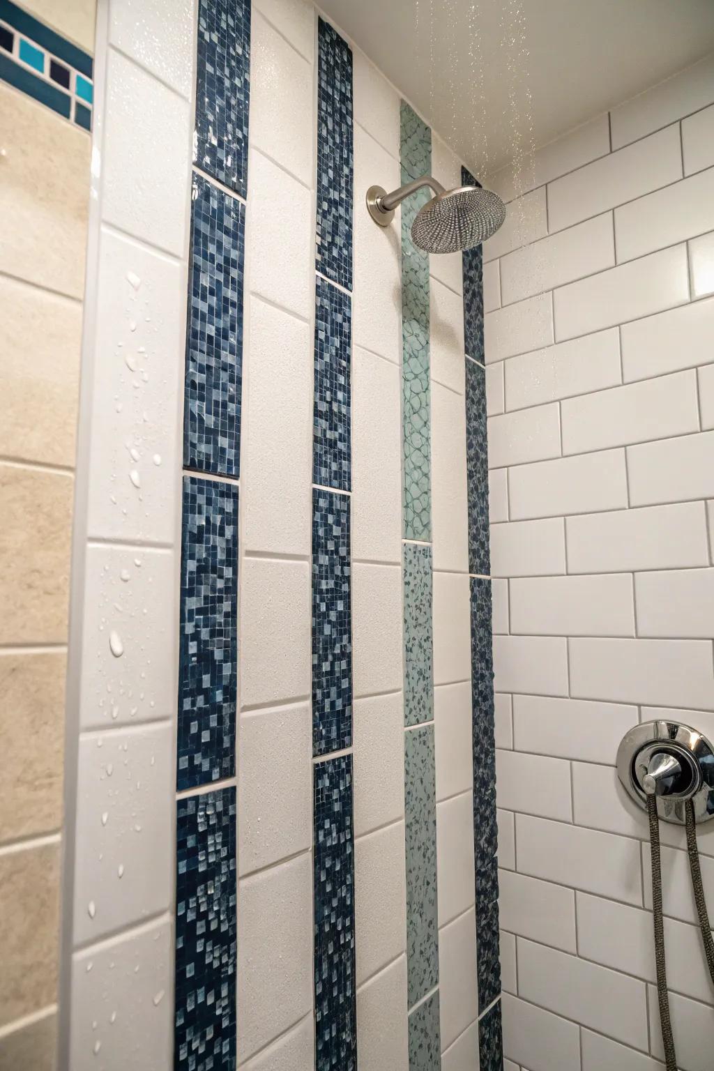 Vertical stripes in accent tiles can heighten the perceived dimension of the shower.