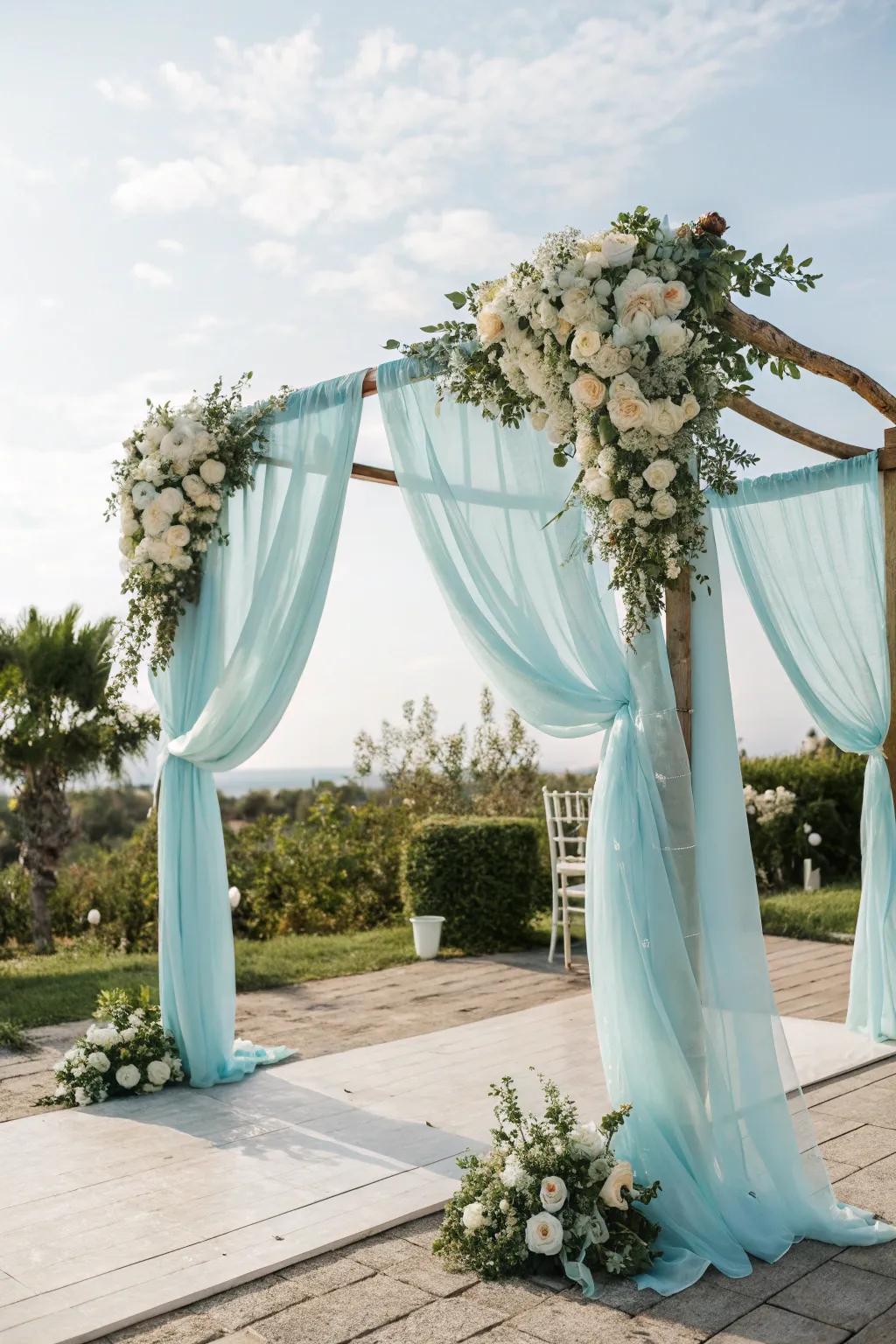 A pale azure wedding arch crafts a breathtaking ceremonial focal point.
