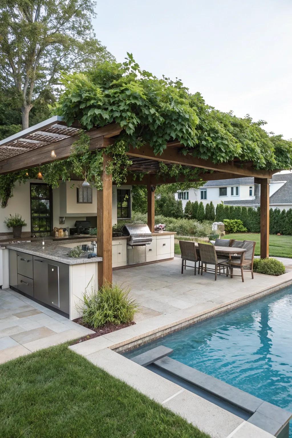 Pergola featuring an exterior kitchen enriches poolside entertainment.