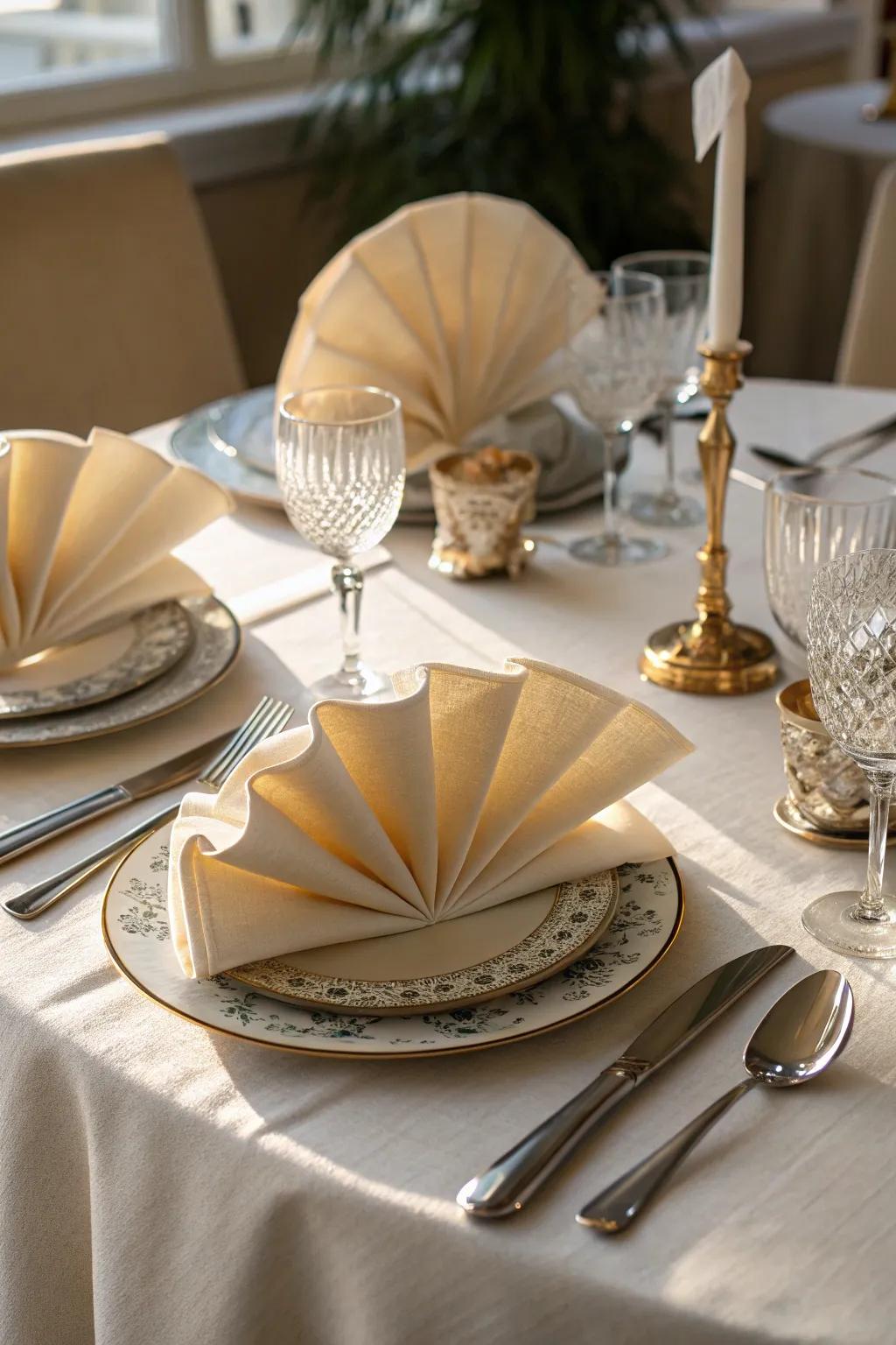 Fan-folded napkins radiate timeless elegance at your Thanksgiving feast.
