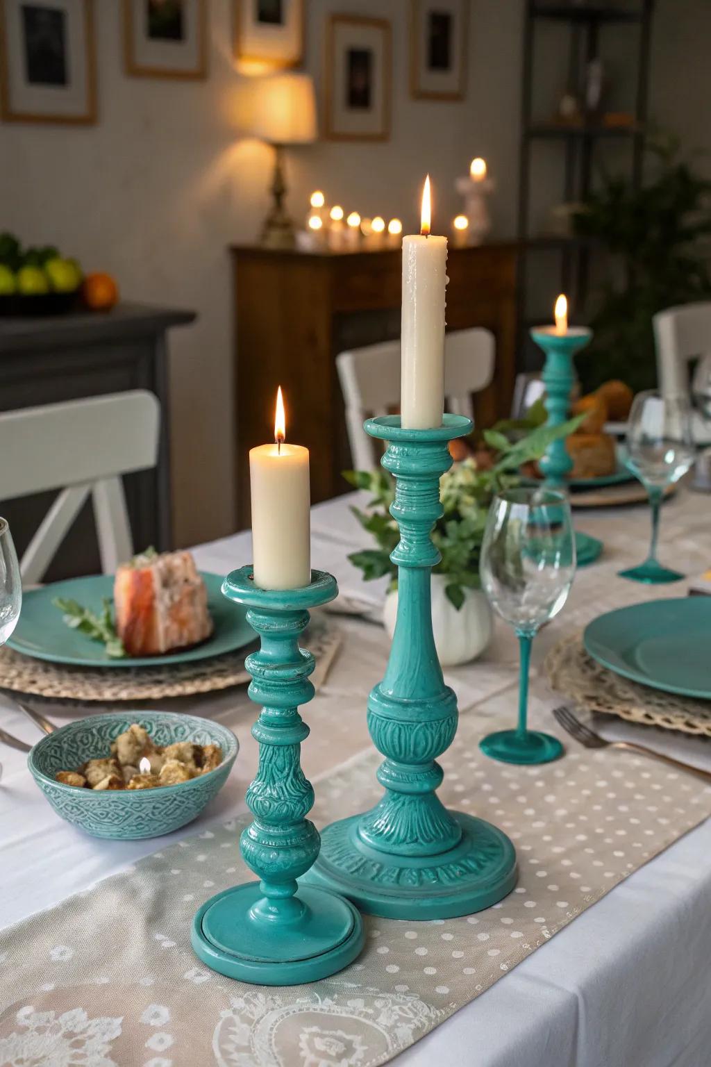 Candles within teal vessels fashion a warm and appealing ambiance.