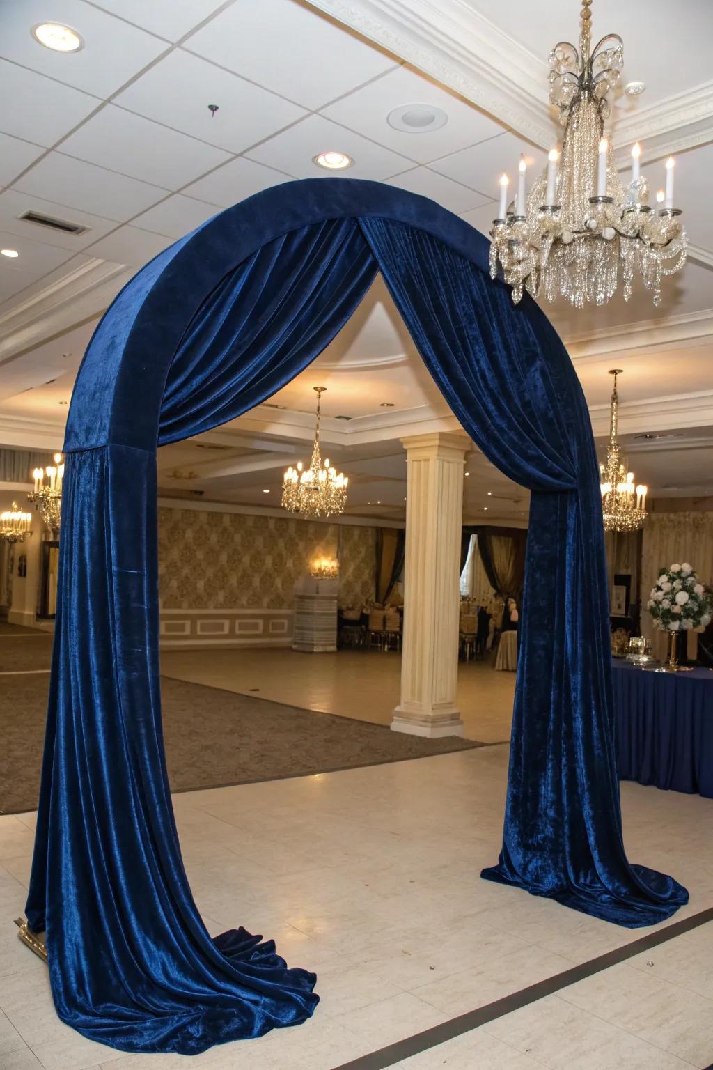 An elegant arch using lavish velvet fabric for a dramatic appearance.
