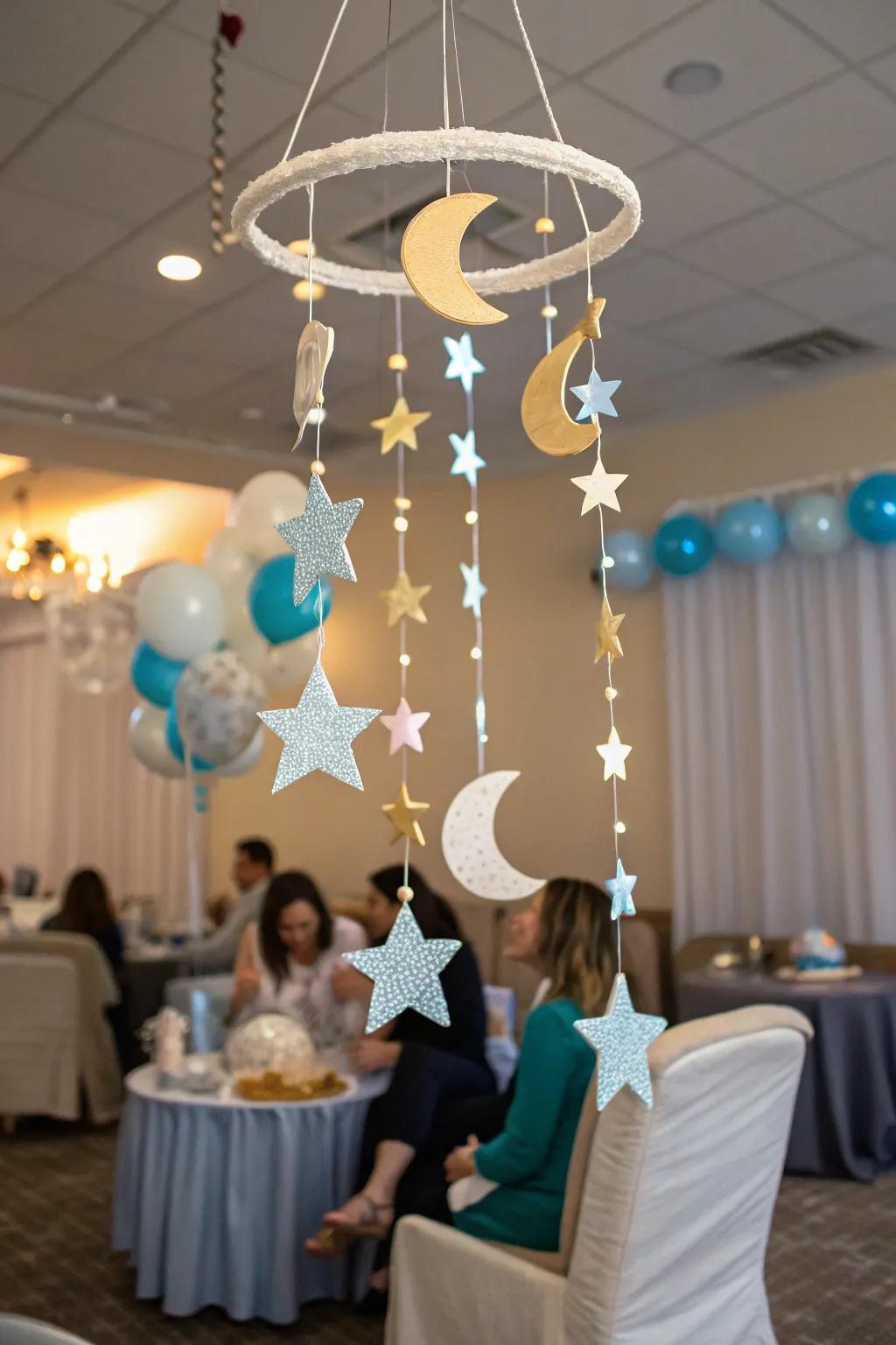 An imaginative mobile featuring celestial bodies contributes a magical element to the baby shower decor.